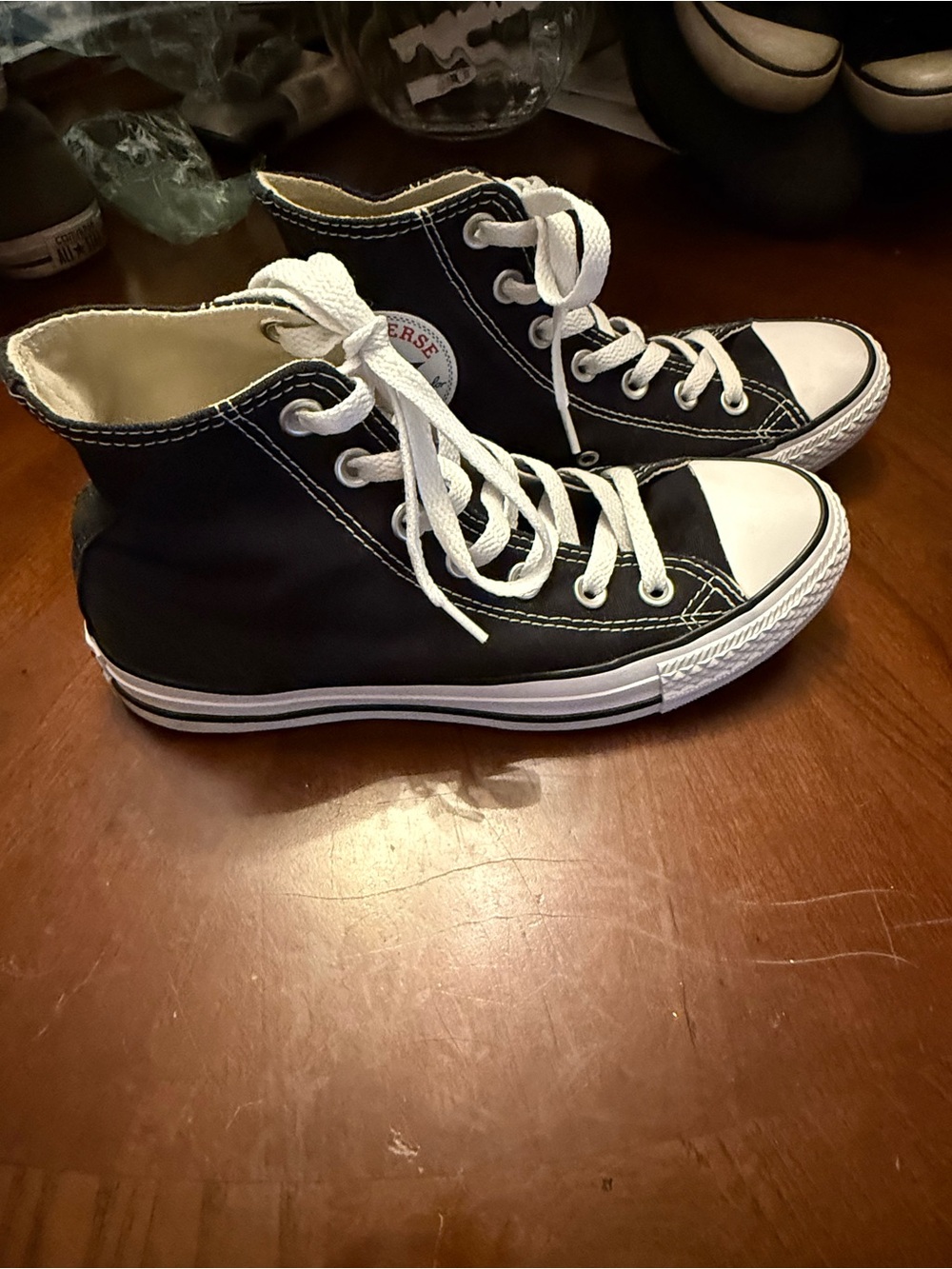 Converse Women’s  Black and White High Top Sneakers